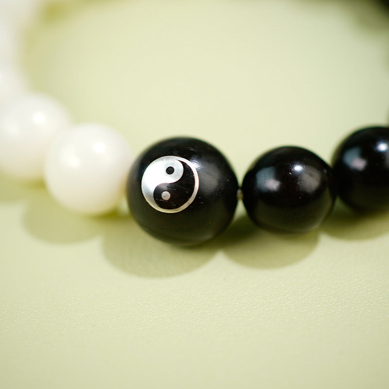 Purple sandalwood inlaid with silver Yin-Yang Tai Chi Taoist flowing beads bracelet, white jade Bodhi ebony inlaid Yin-Yang fish bracelet