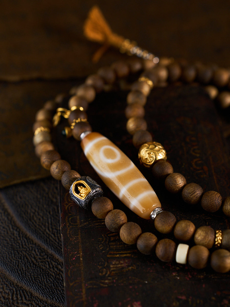 Dual Harmony of Love & Prosperity – Two-Eyed Dzi Bead Agarwood 108 Mala Necklace