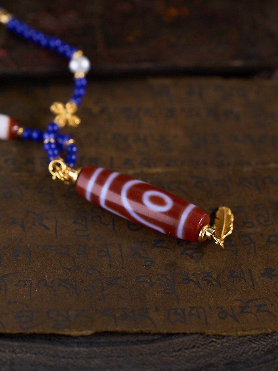 Dual Blessings of Wealth & Harmony – Two-Eyed Cinnabar Dzi Bead Lapis Lazuli Necklace
