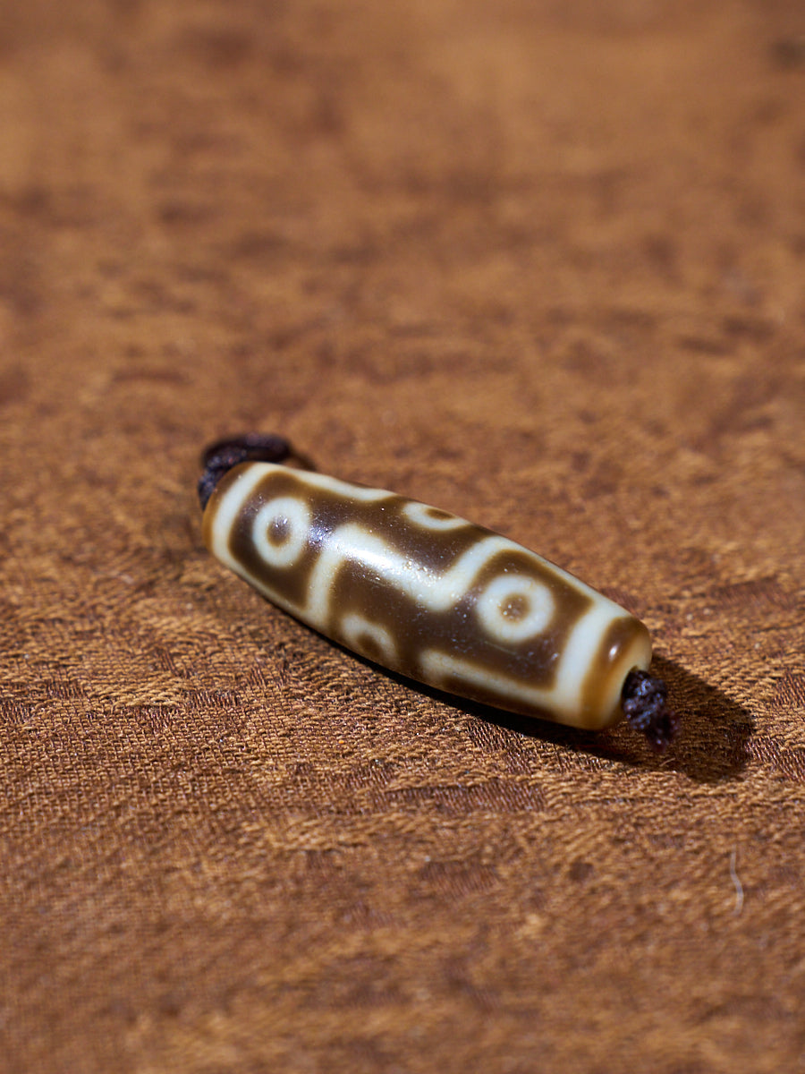 Ninefold Convergence · One-of-a-Kind Nine-Eyed Dzi Bead