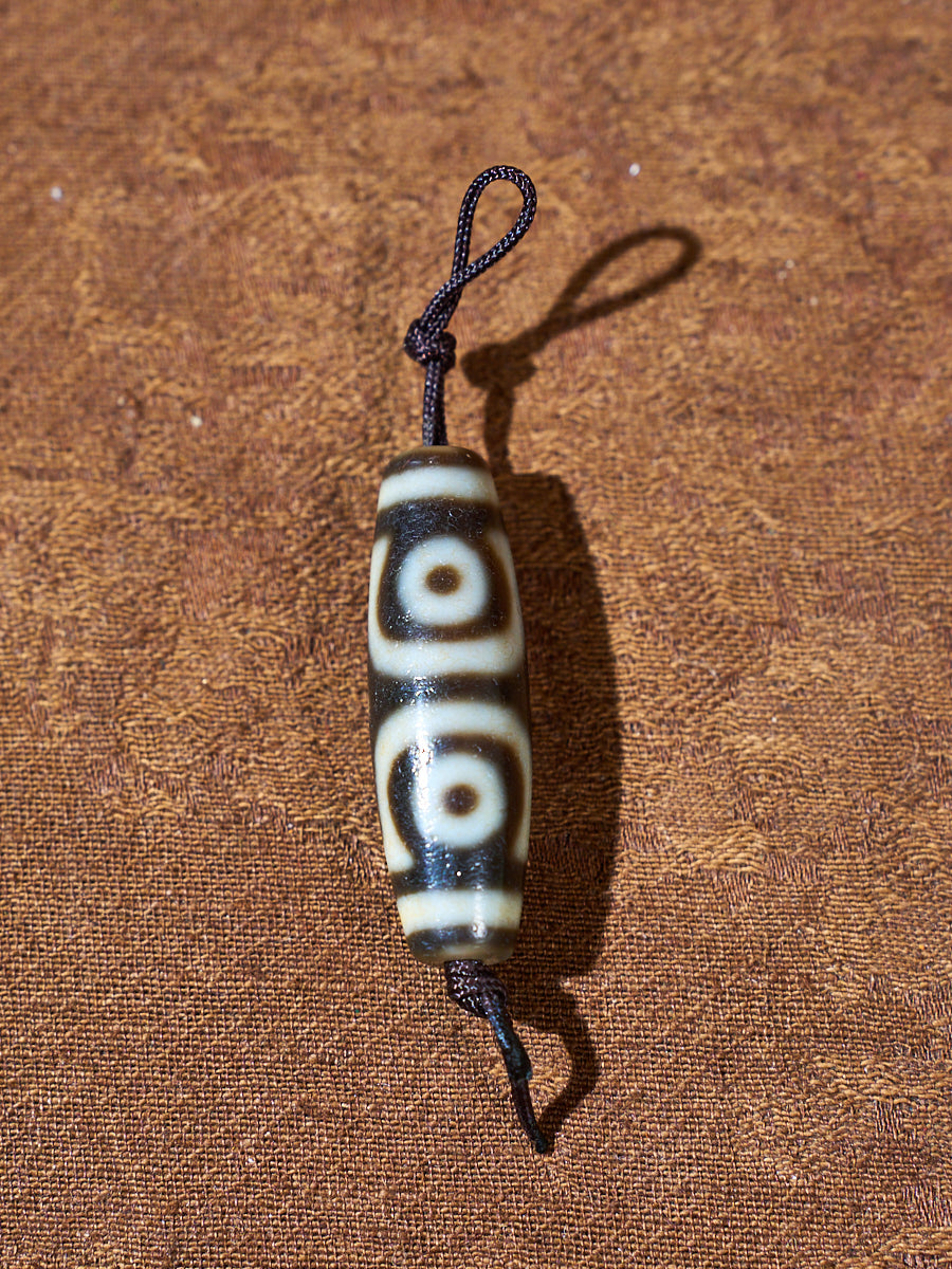 Ninefold Convergence · One-of-a-Kind Nine-Eyed Dzi Bead
