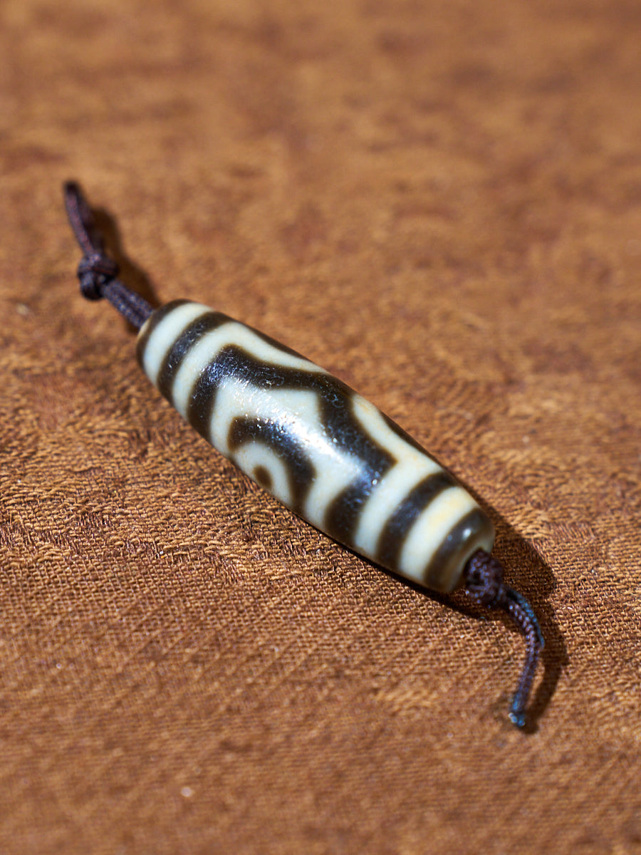 Ninefold Convergence · One-of-a-Kind Nine-Eyed Dzi Bead