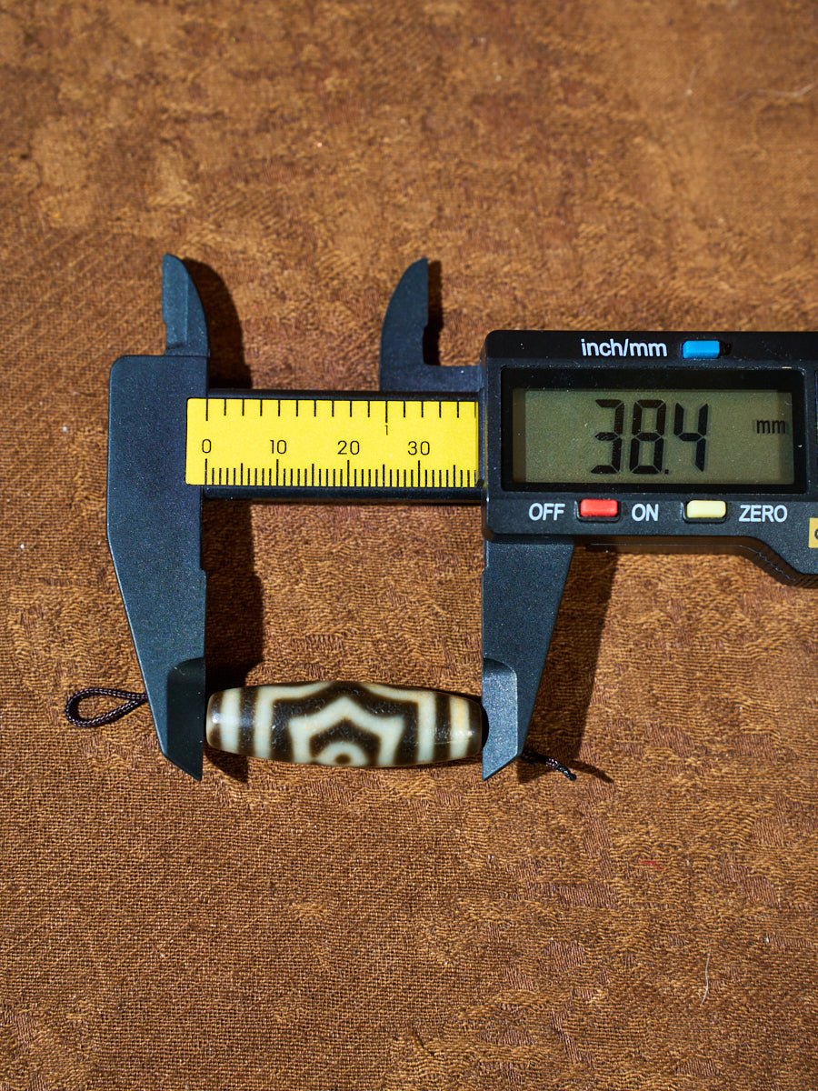 Ninefold Convergence · One-of-a-Kind Nine-Eyed Dzi Bead