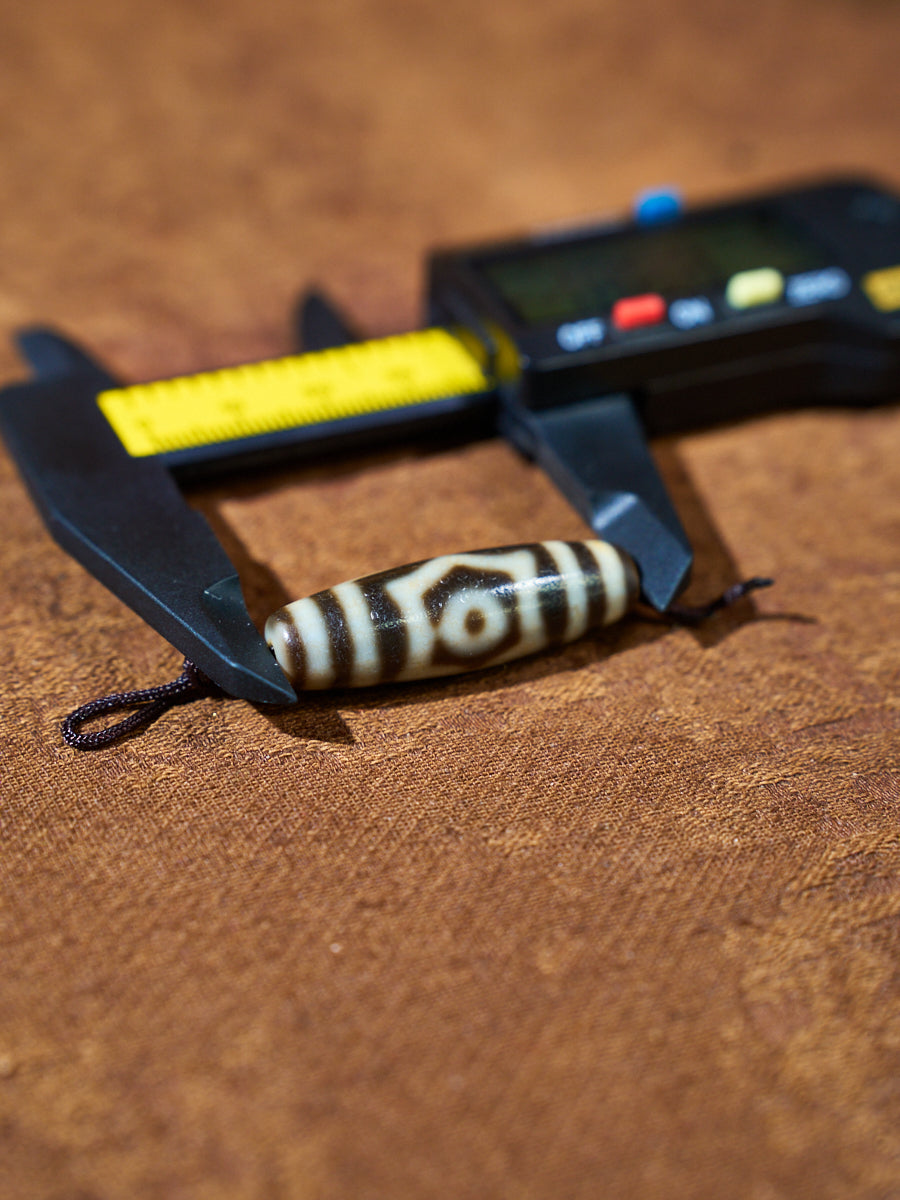 Ninefold Convergence · One-of-a-Kind Nine-Eyed Dzi Bead