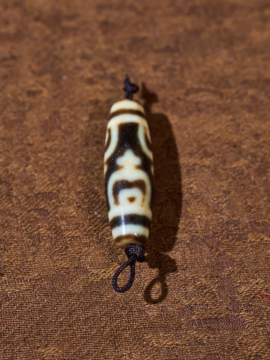 Ninefold Convergence · One-of-a-Kind Nine-Eyed Dzi Bead