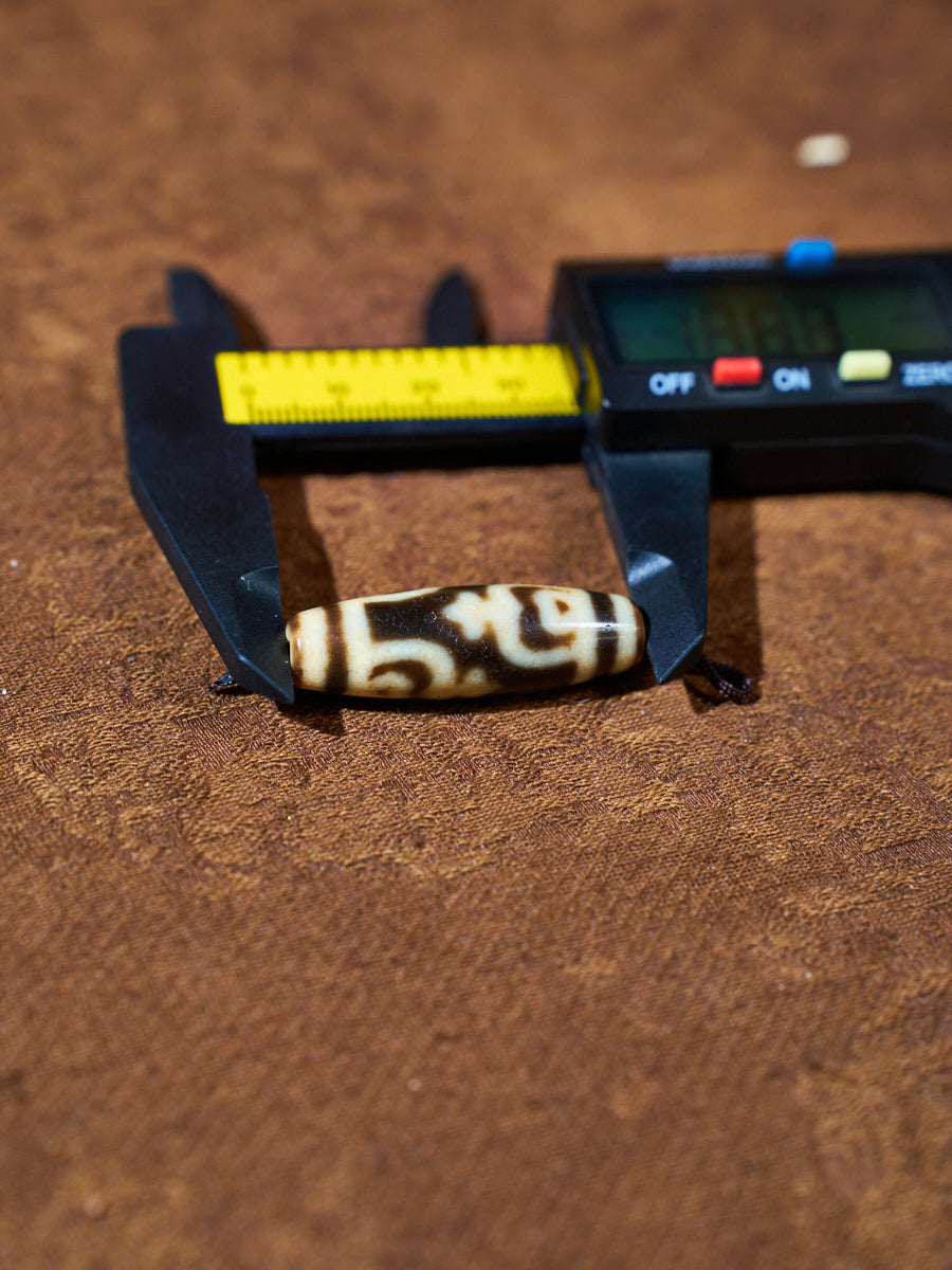 Ninefold Convergence · One-of-a-Kind Nine-Eyed Dzi Bead