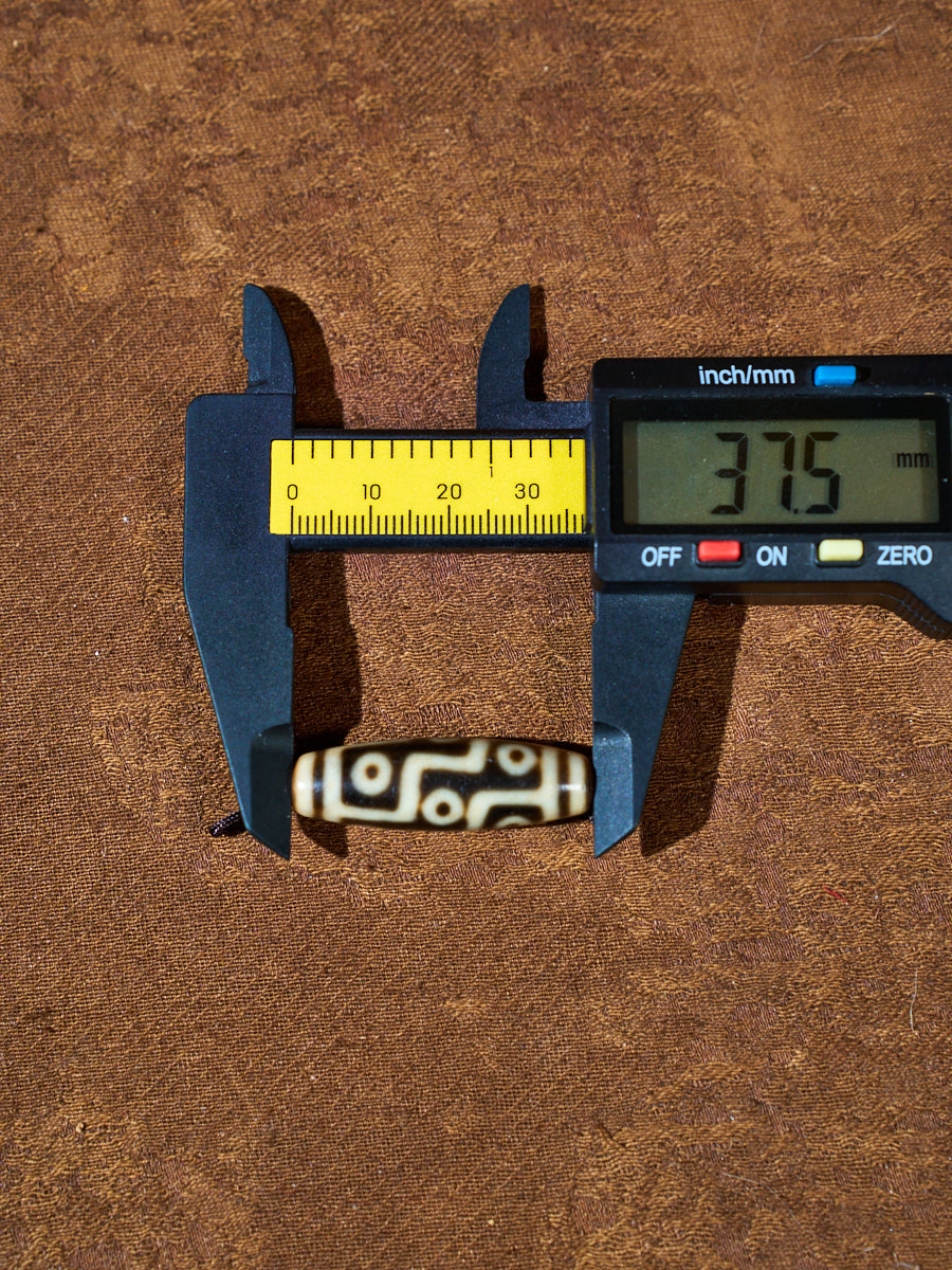 Ninefold Convergence · One-of-a-Kind Nine-Eyed Dzi Bead