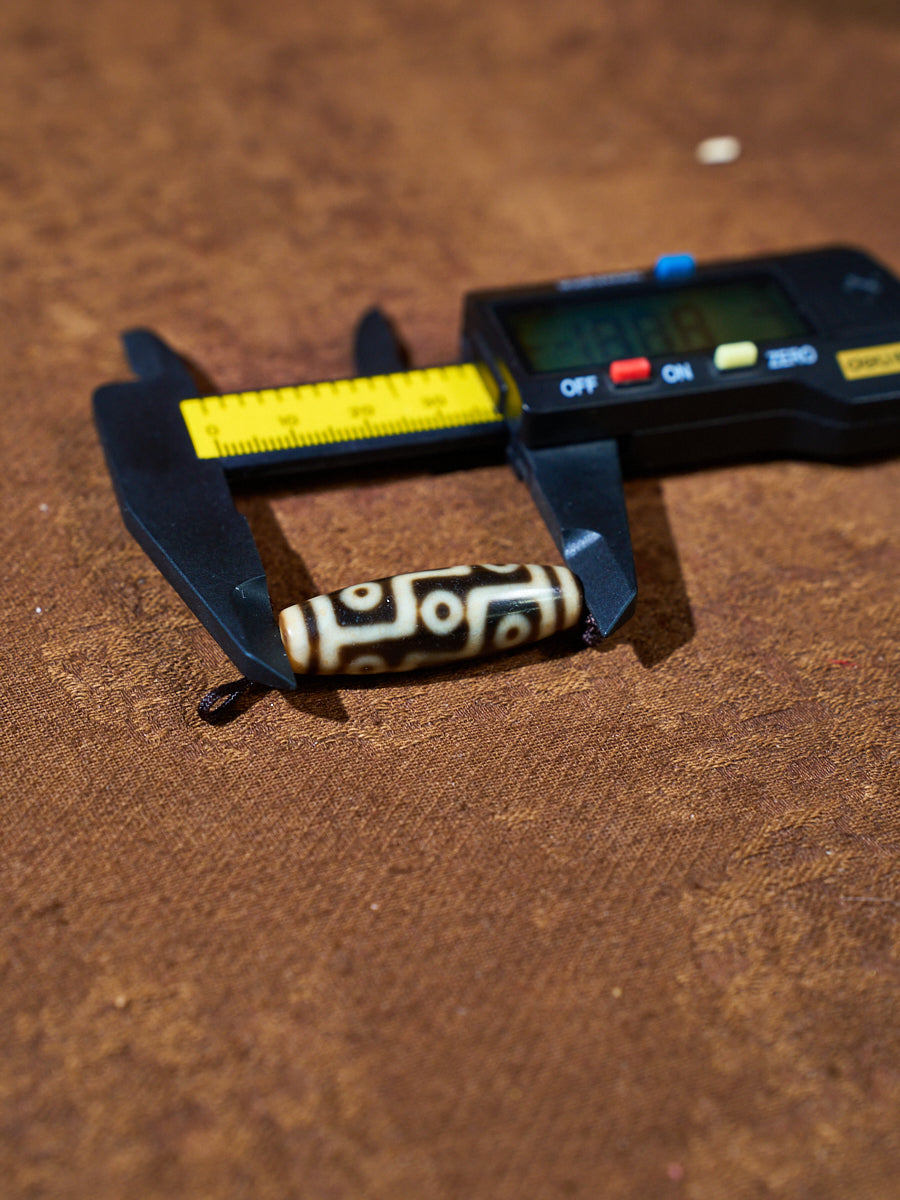 Ninefold Convergence · One-of-a-Kind Nine-Eyed Dzi Bead