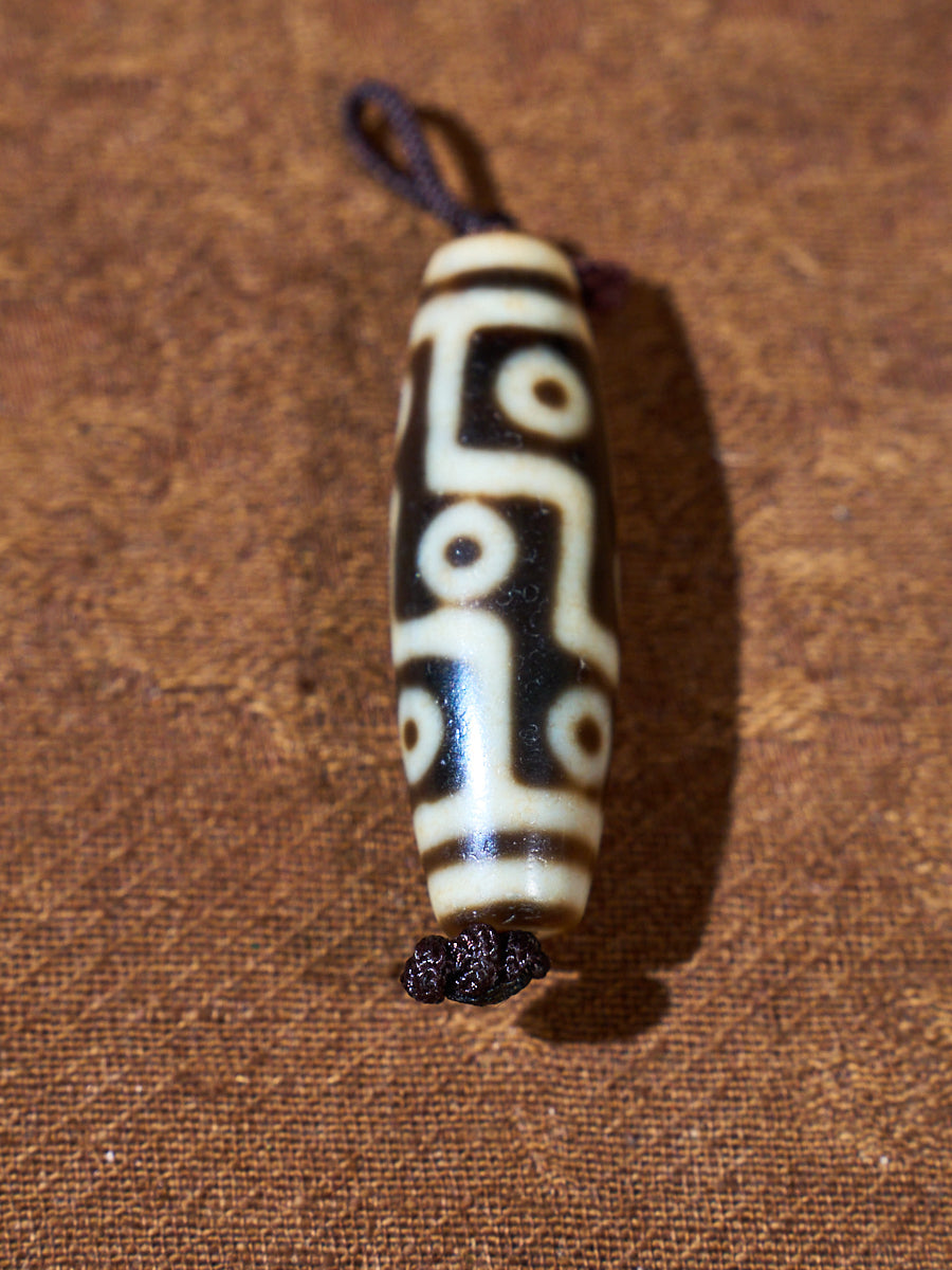Ninefold Convergence · One-of-a-Kind Nine-Eyed Dzi Bead