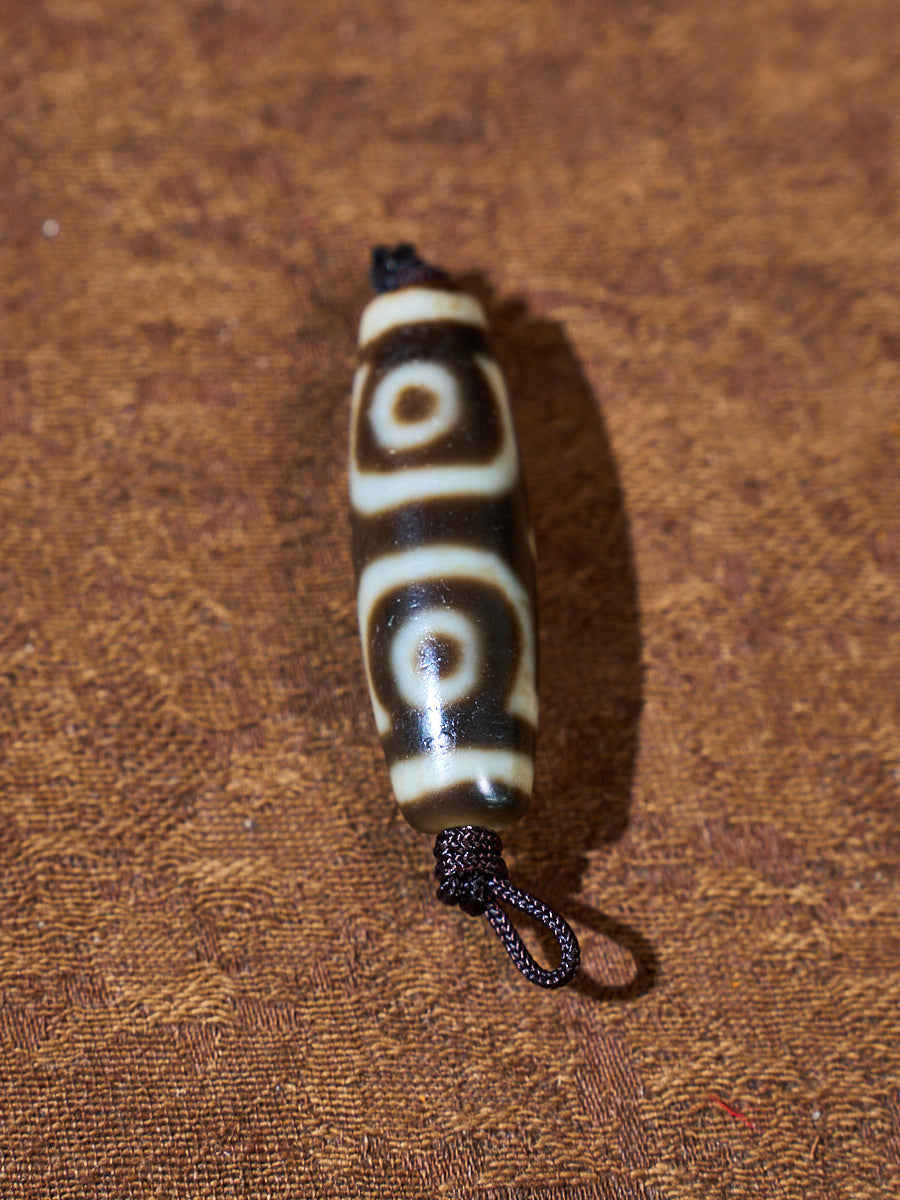 Ninefold Convergence · One-of-a-Kind Nine-Eyed Dzi Bead