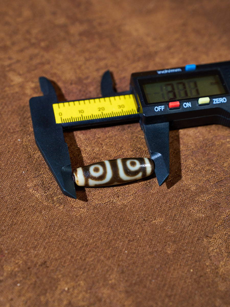Ninefold Convergence · One-of-a-Kind Nine-Eyed Dzi Bead