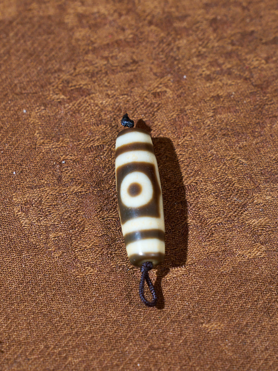 Ninefold Convergence · One-of-a-Kind Nine-Eyed Dzi Bead