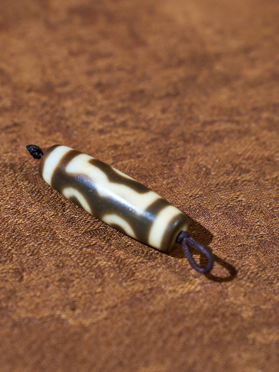Ninefold Convergence · One-of-a-Kind Nine-Eyed Dzi Bead