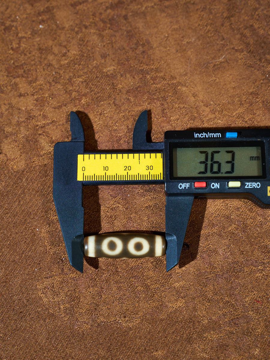 Ninefold Convergence · One-of-a-Kind Nine-Eyed Dzi Bead