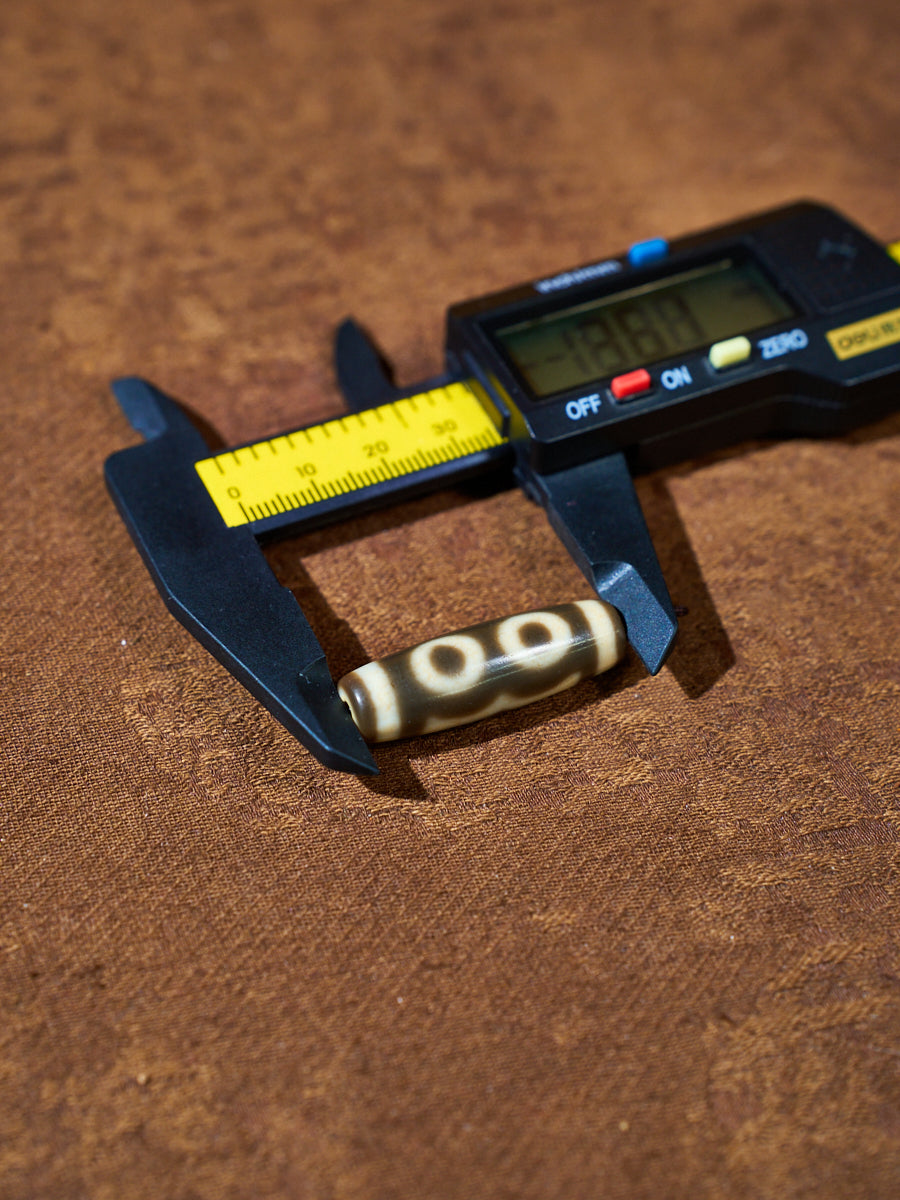 Ninefold Convergence · One-of-a-Kind Nine-Eyed Dzi Bead