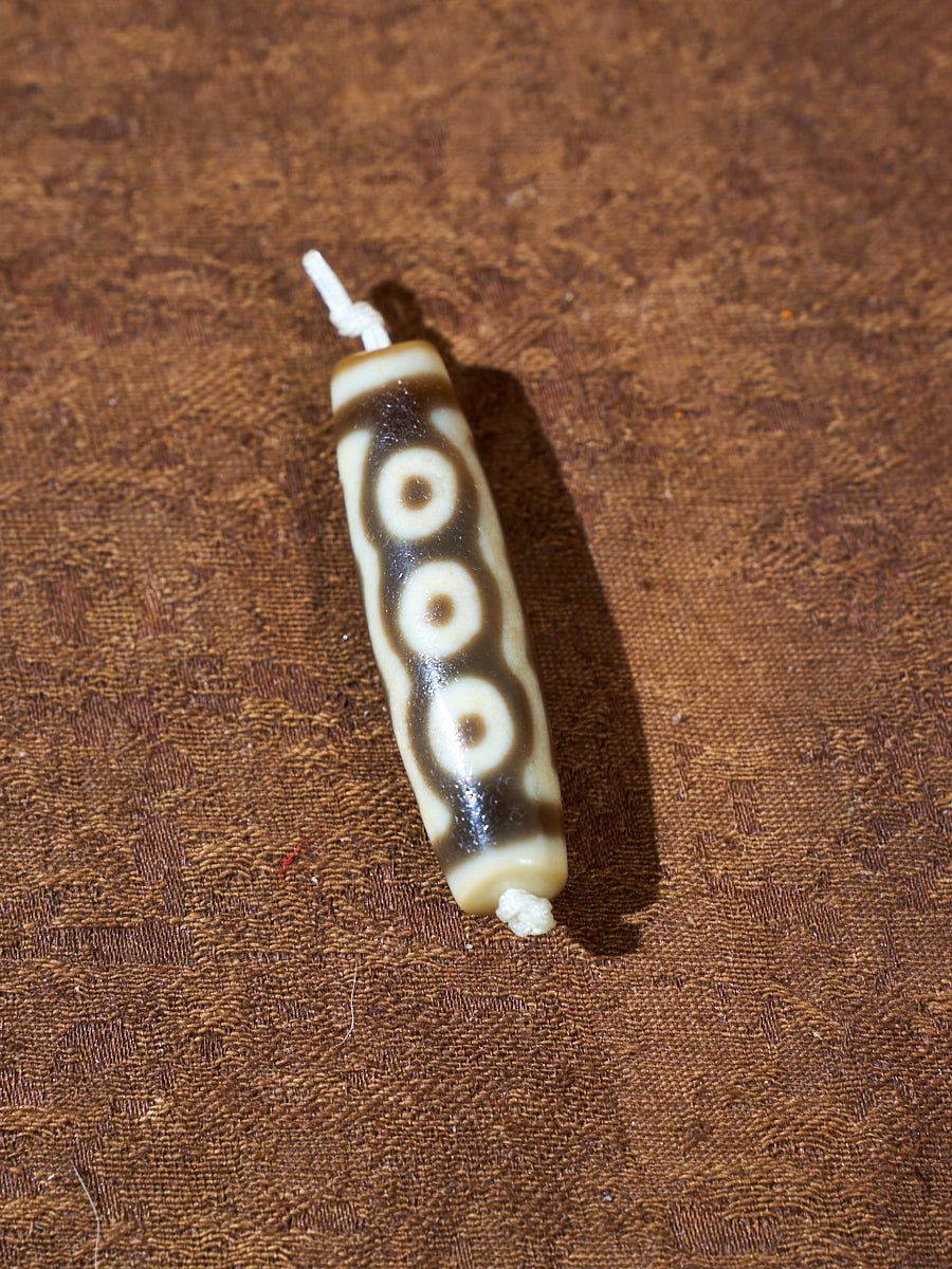 Ninefold Convergence · One-of-a-Kind Nine-Eyed Dzi Bead