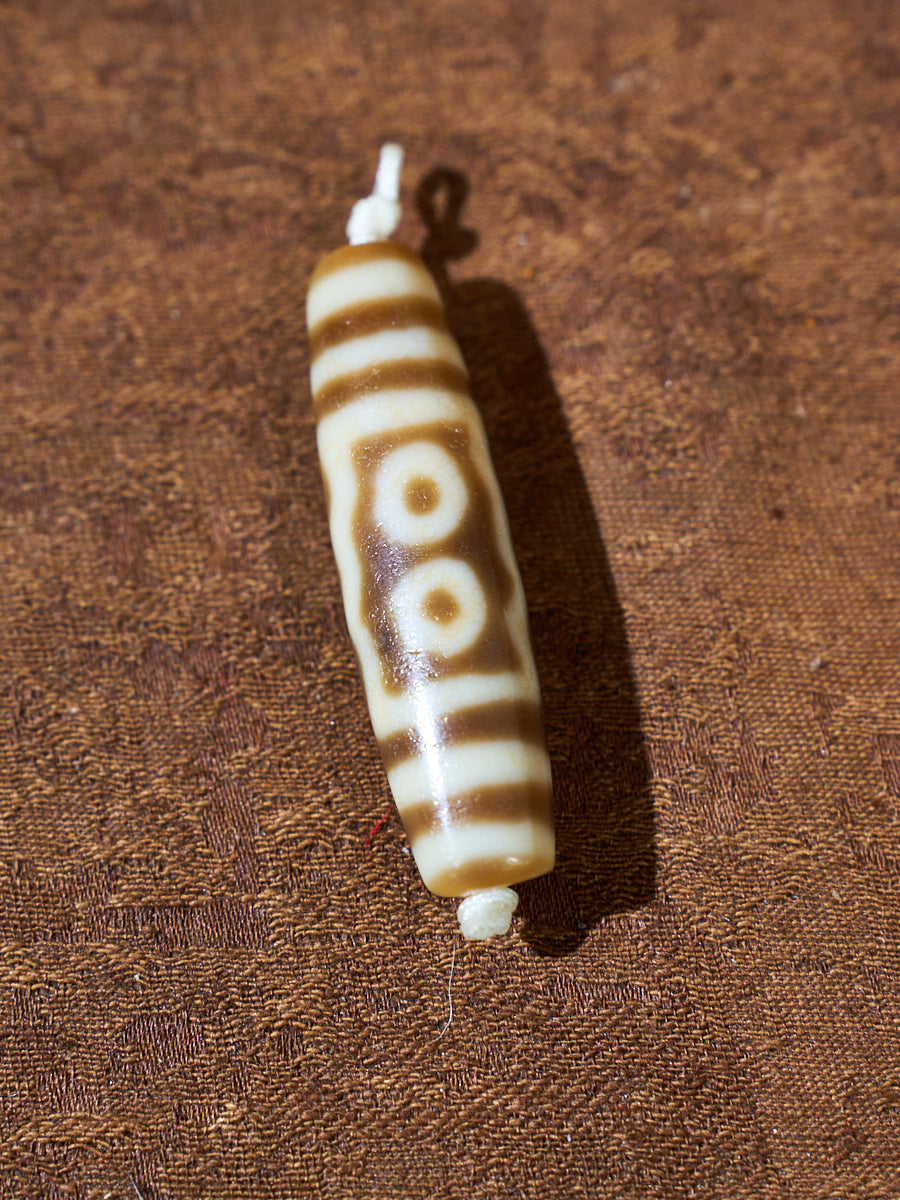 Ninefold Convergence · One-of-a-Kind Nine-Eyed Dzi Bead