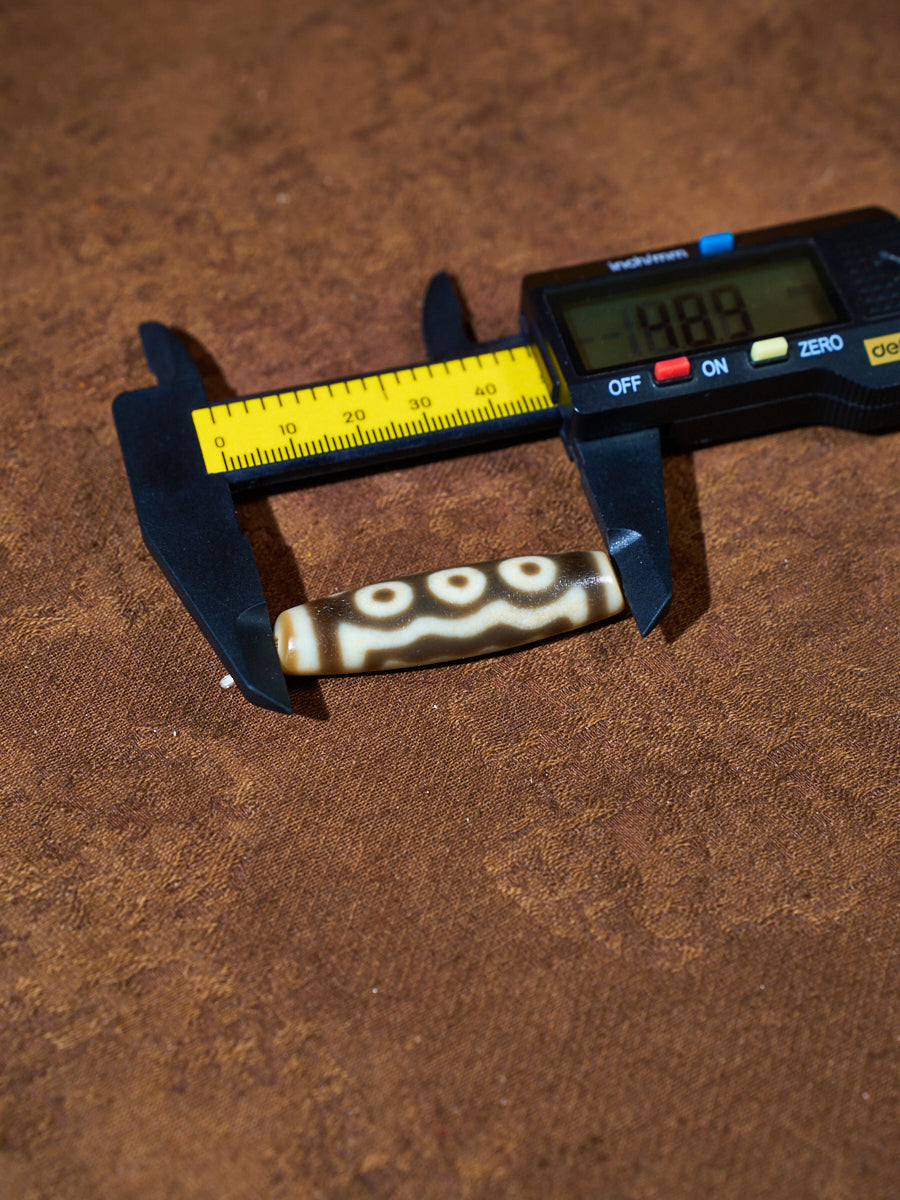 Ninefold Convergence · One-of-a-Kind Nine-Eyed Dzi Bead