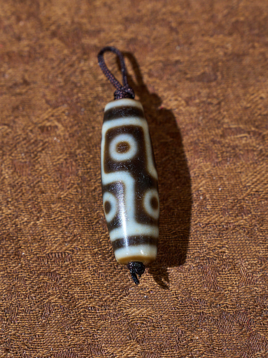 Ninefold Convergence · One-of-a-Kind Nine-Eyed Dzi Bead