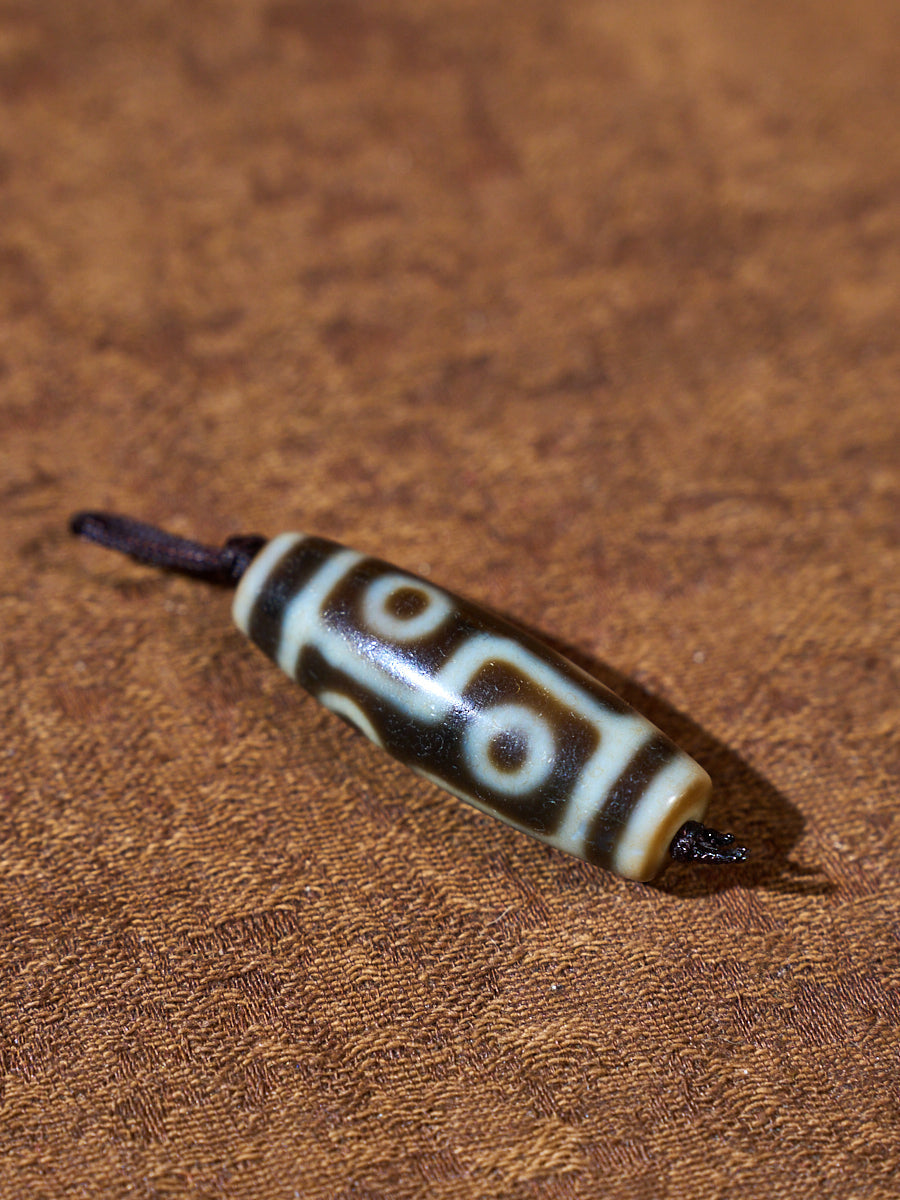 Ninefold Convergence · One-of-a-Kind Nine-Eyed Dzi Bead