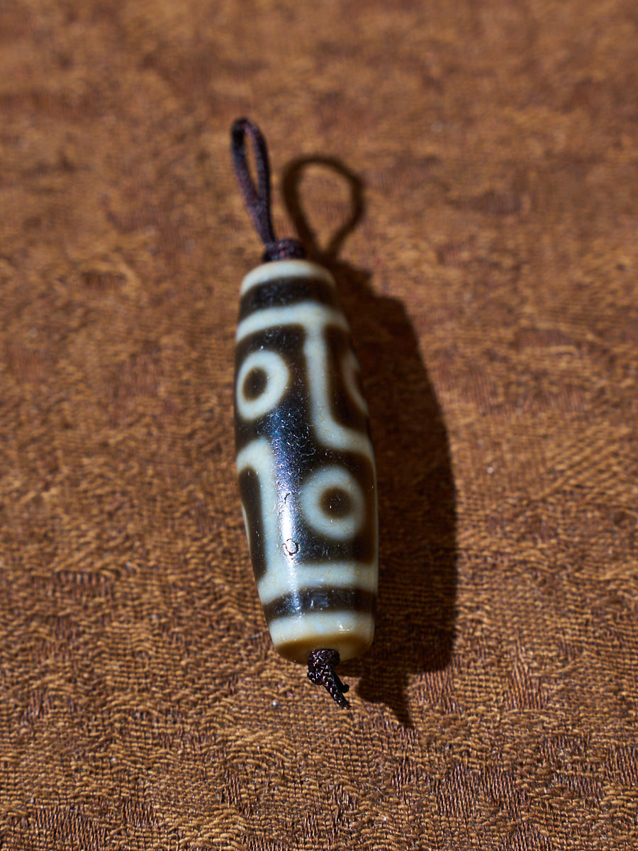 Ninefold Convergence · One-of-a-Kind Nine-Eyed Dzi Bead