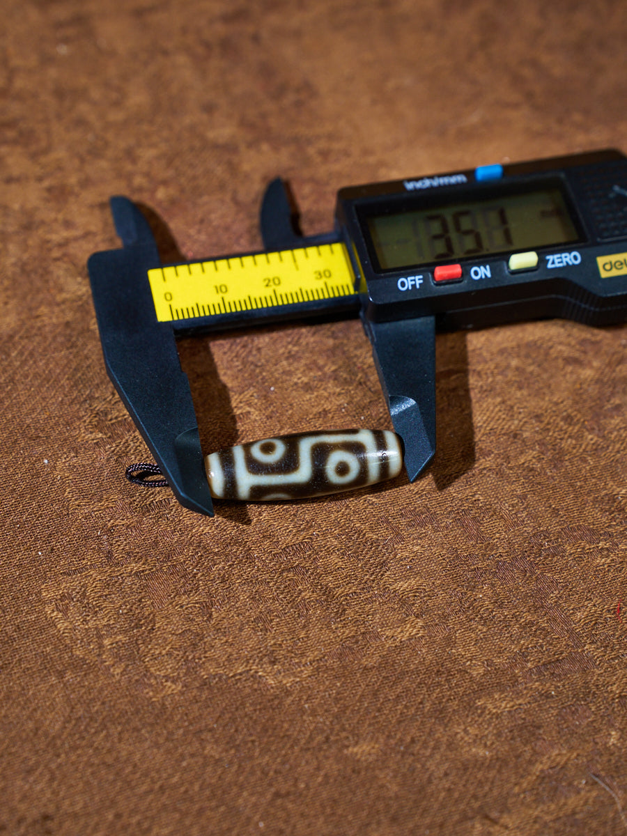 Ninefold Convergence · One-of-a-Kind Nine-Eyed Dzi Bead