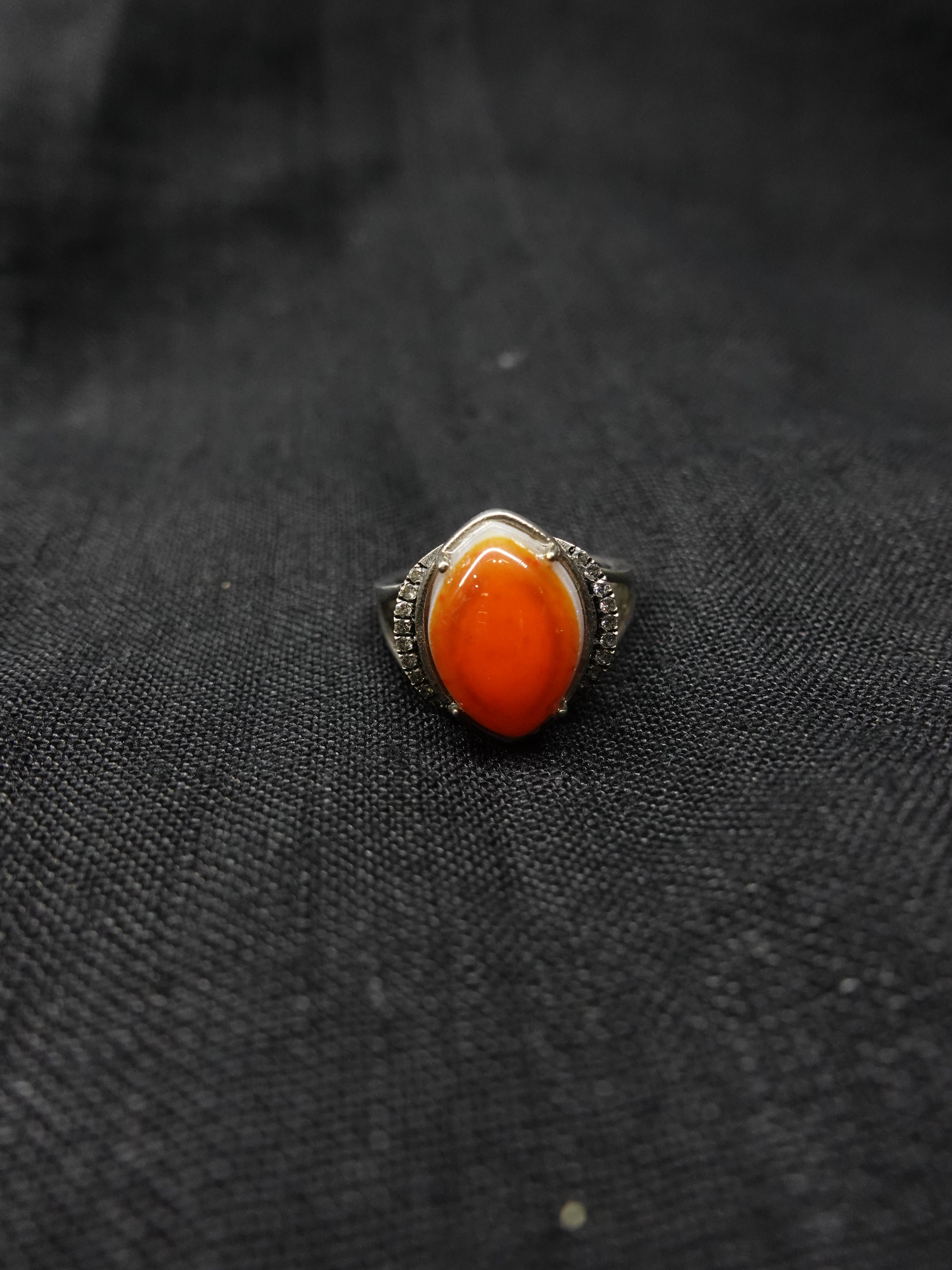 Diamond-encrusted eye-shaped South Red ring