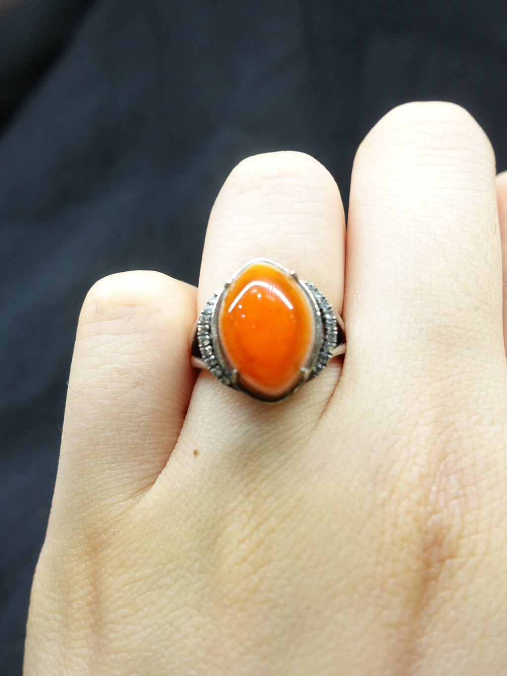 Diamond-encrusted eye-shaped South Red ring