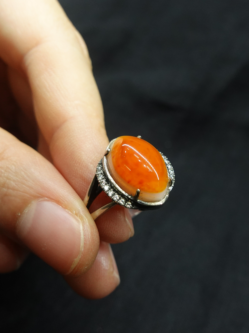 Diamond-encrusted eye-shaped South Red ring