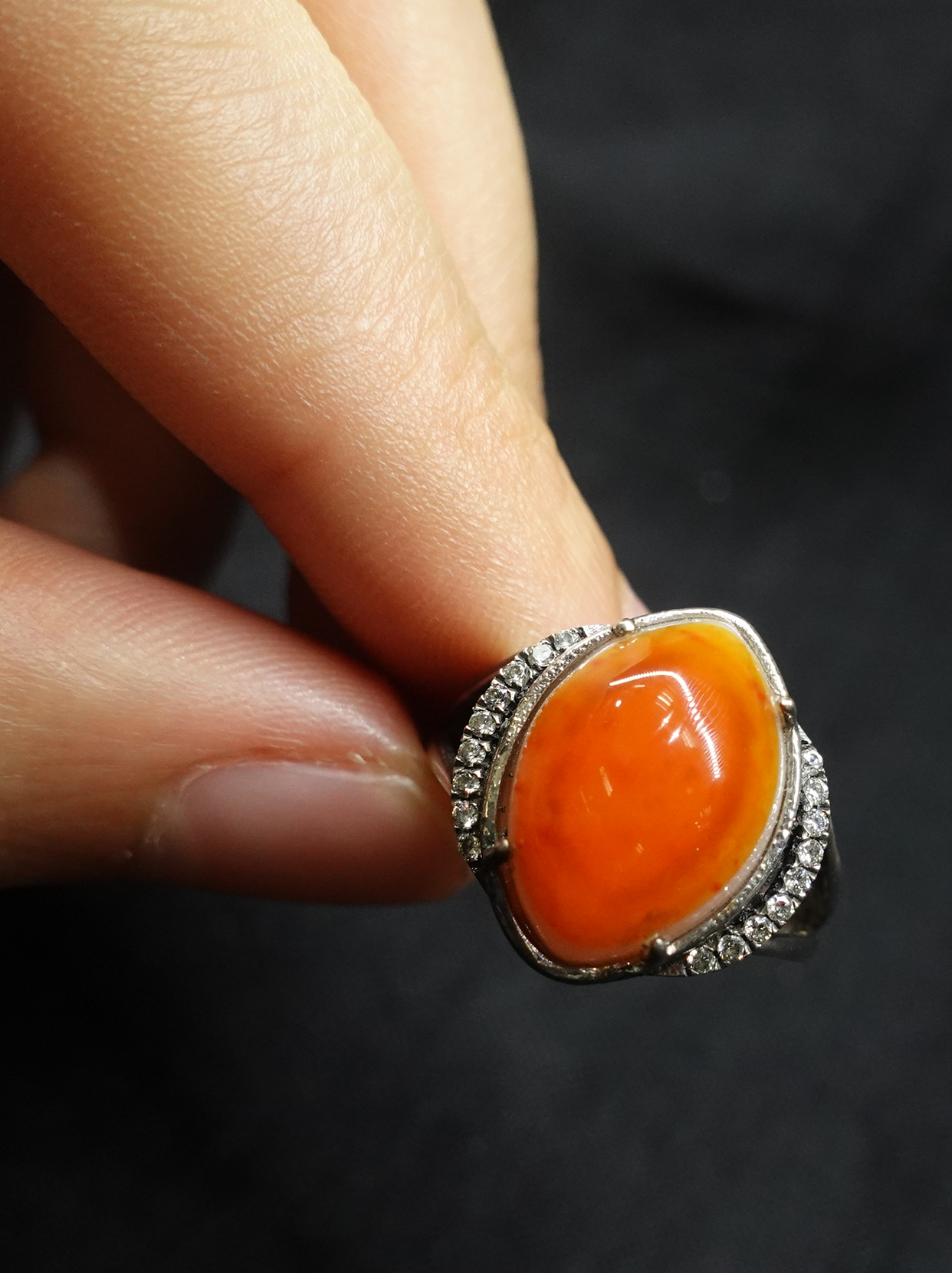 Diamond-encrusted eye-shaped South Red ring