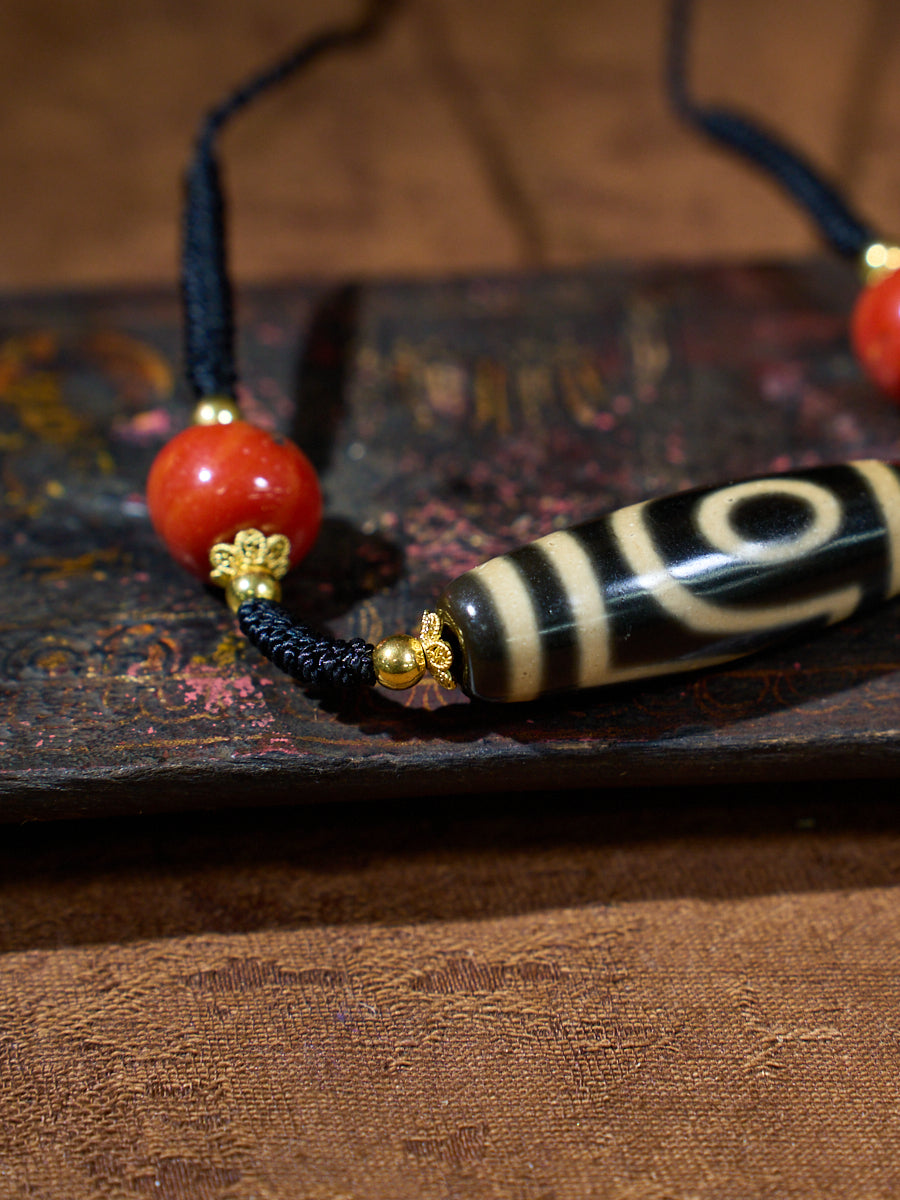 Ancient Clearing · Two-Eyed Dzi & Coral Necklace
