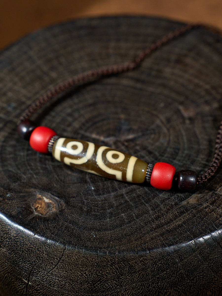 Three-Eyed Dzi Bead Necklace – Tibetan Symbol of Protection & Spiritual Balance