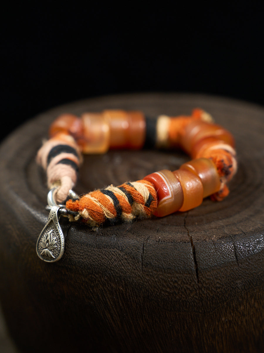 South Red Agate Tibetan Thread Silver Charm Bracelet