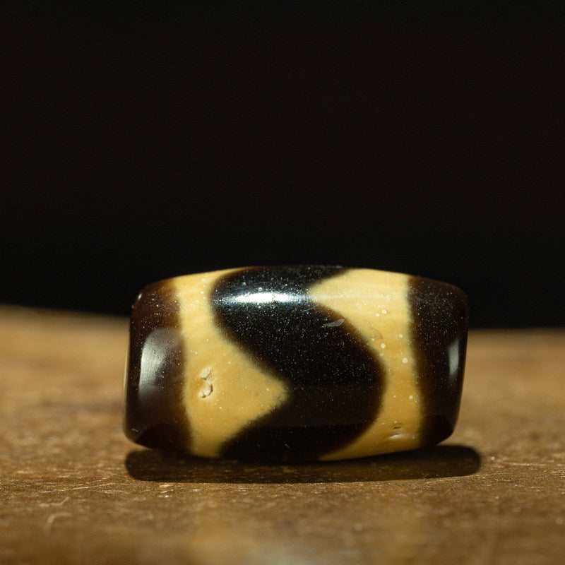 Tibetan Ancient Tiger Tooth Dzi Bead – Grade A Ivory Yellow, Nine-Eye Shale, Perfect Calcification