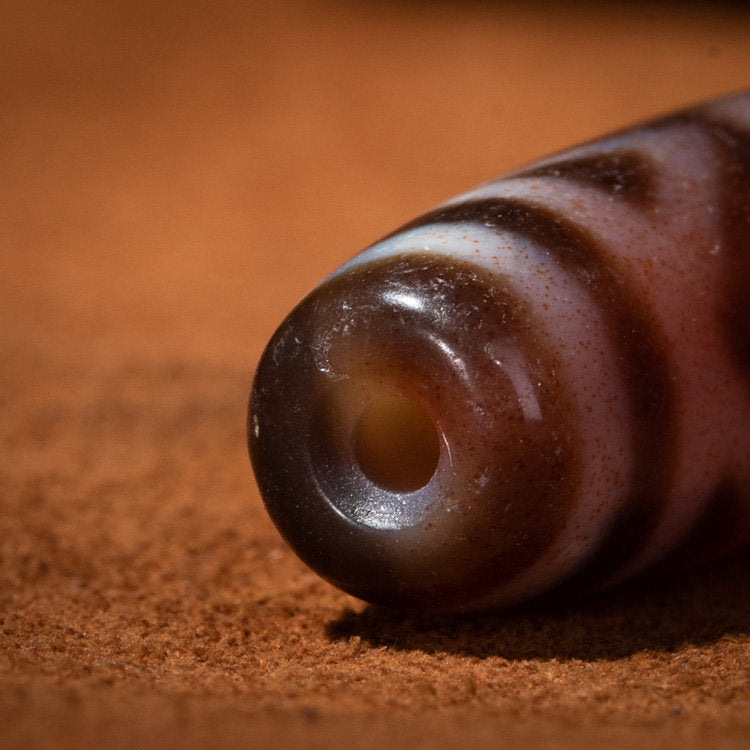 Tibetan Rare Hollow Tiger Tooth Three-Eye Dzi Bead – Abundant Cinnabar, Nine-Eye Shale Antique